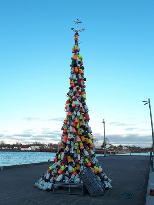 a tall tree made of fishing buoys in the shape of a christmas tree in pugwash nova scotia