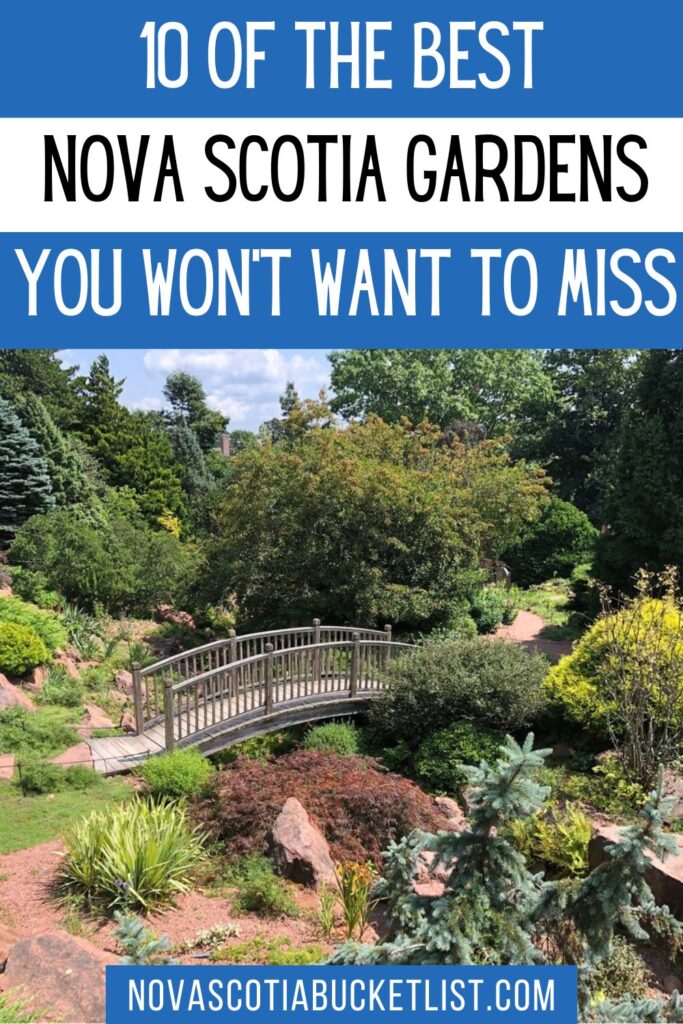 A vibrant garden scene in Nova Scotia with a gently arched wooden bridge over a dry stream bed, surrounded by dense greenery, colorful shrubs, and a clear blue sky. Bold blue and white text above the image reads “10 of the Best Nova Scotia Gardens You Won’t Want to Miss,” with the website novascotiabucketlist.com at the bottom.